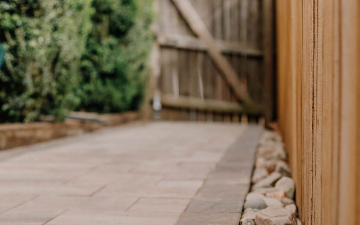 Clean sandstone patio paving in a back garden